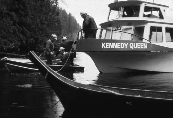 MacMillan Bloedel’s crew boat, Kennedy Queen, navigated through a flotilla of boats in Heelboom (C’is-a-quis) Bay on the morning of November 21, 1984. Anti-logging protesters filled the boats and lined the shoreline of Meares Island in this historic faceoff, to prevent loggers going ashore with chainsaws.