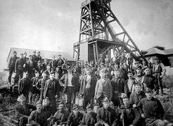 Nanaimo coal miners gather at the pithead of one of the area’s first mines in the early 1870s. Image B-03624, Royal BC Museum and Archives.